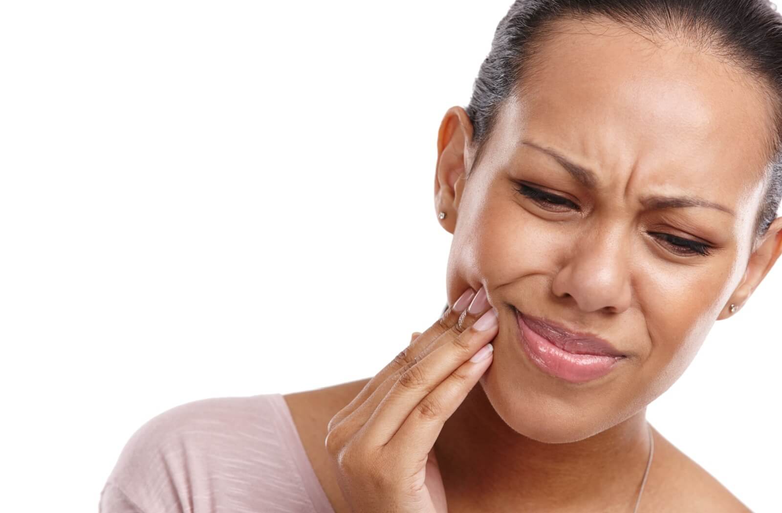 A dental professional shows their patient how they are going to replace a missing tooth.